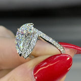 Solarii Gorgeous 6.0ct Pear Cut Hidden Halo Asymmetric Shank Engagement Ring