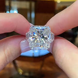 Effervescent Radiant Cut 12.0ct Three Stone Engagement Ring In Sterling Silver