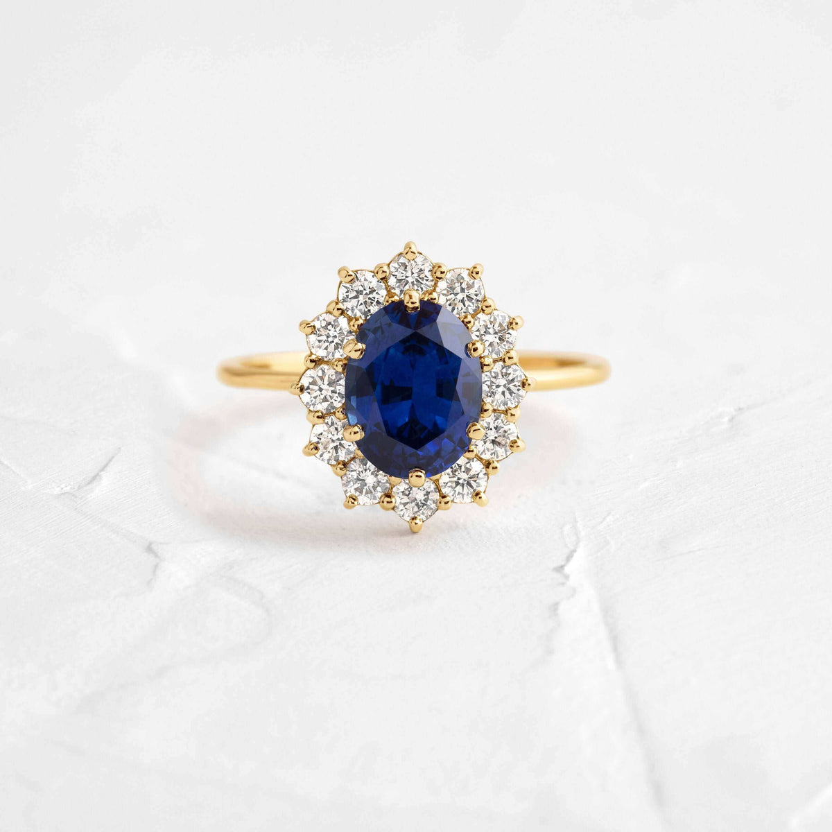 Dazzling 1.5ct Oval Cut Blue Stone Halo Sterling Silver Engagement Ring