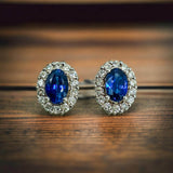 Dazzling Oval Cut Blue Stone Halo Sterling Silver Earrings