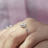 Fashionable Solarii Moissanite 2.0ct Emerald Cut 925 Sterling Silver Twist Design Engagement Ring