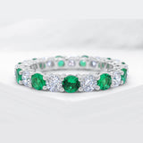 Intricate Round Cut White Stone & Emerald Stone 925 Sterling Silver Wedding Band