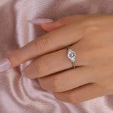 Ornate Solarii Moissanite 1.2ct Round Cut 925 Sterling Silver Side Stone Engagement Ring