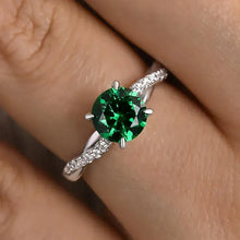 Timeless 1.25ct Twist Round Cut Emerald Green Engagement Ring In Sterling Silver
