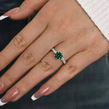 Timeless 1.25ct Twist Round Cut Emerald Green Engagement Ring In Sterling Silver