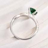 Timeless 1.25ct Twist Round Cut Emerald Green Engagement Ring In Sterling Silver