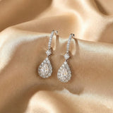 Solarii Halo White Stone Pear Cut Drop Earrings In Sterling Silver