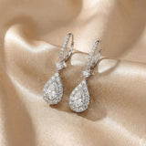 Solarii Halo White Stone Pear Cut Drop Earrings In Sterling Silver