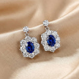 Solarii Oval Cut Blue Stone Halo Drop Earrings in Sterling Silver