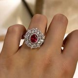 Dazzling Flower Shape 1.0ct Oval Cut Ruby Engagement Ring In Sterling Silver