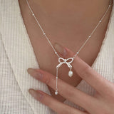 Lustrous Bowknot Pearl Pendant Necklace In Sterling Silver For Woman