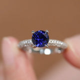 Elegant 1.0ct Blue Sapphire Round Cut Pave Engagement Ring In Sterling Silver