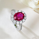 Timeless 2.0ct Oval Cut Halo Ruby Engagement Ring In Sterling Silver