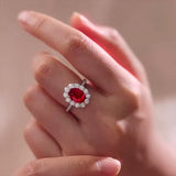 Timeless 2.0ct Oval Cut Halo Ruby Engagement Ring In Sterling Silver