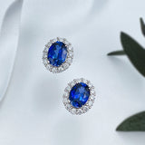 Dazzling Oval Cut Blue Stone Halo Sterling Silver Earrings