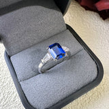 Gleaming 2.5ct Blue Sapphire Emerald Cut Engagement Ring In Sterling Silver