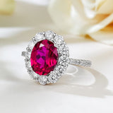 Timeless 2.0ct Oval Cut Halo Ruby Engagement Ring In Sterling Silver