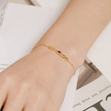 Round Cut Cubic Zirconia and Ruby Bracelet in Sterling Silver/Gold