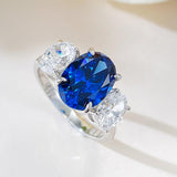 Luxurious 3.75ct Blue Sapphire Oval Cut Three Stones Engagement Ring In Sterling Silver