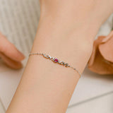 Round Cut Cubic Zirconia and Ruby Bracelet in Sterling Silver/Gold