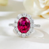 Timeless 2.0ct Oval Cut Halo Ruby Engagement Ring In Sterling Silver