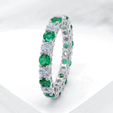 Intricate Round Cut White Stone & Emerald Stone 925 Sterling Silver Wedding Band