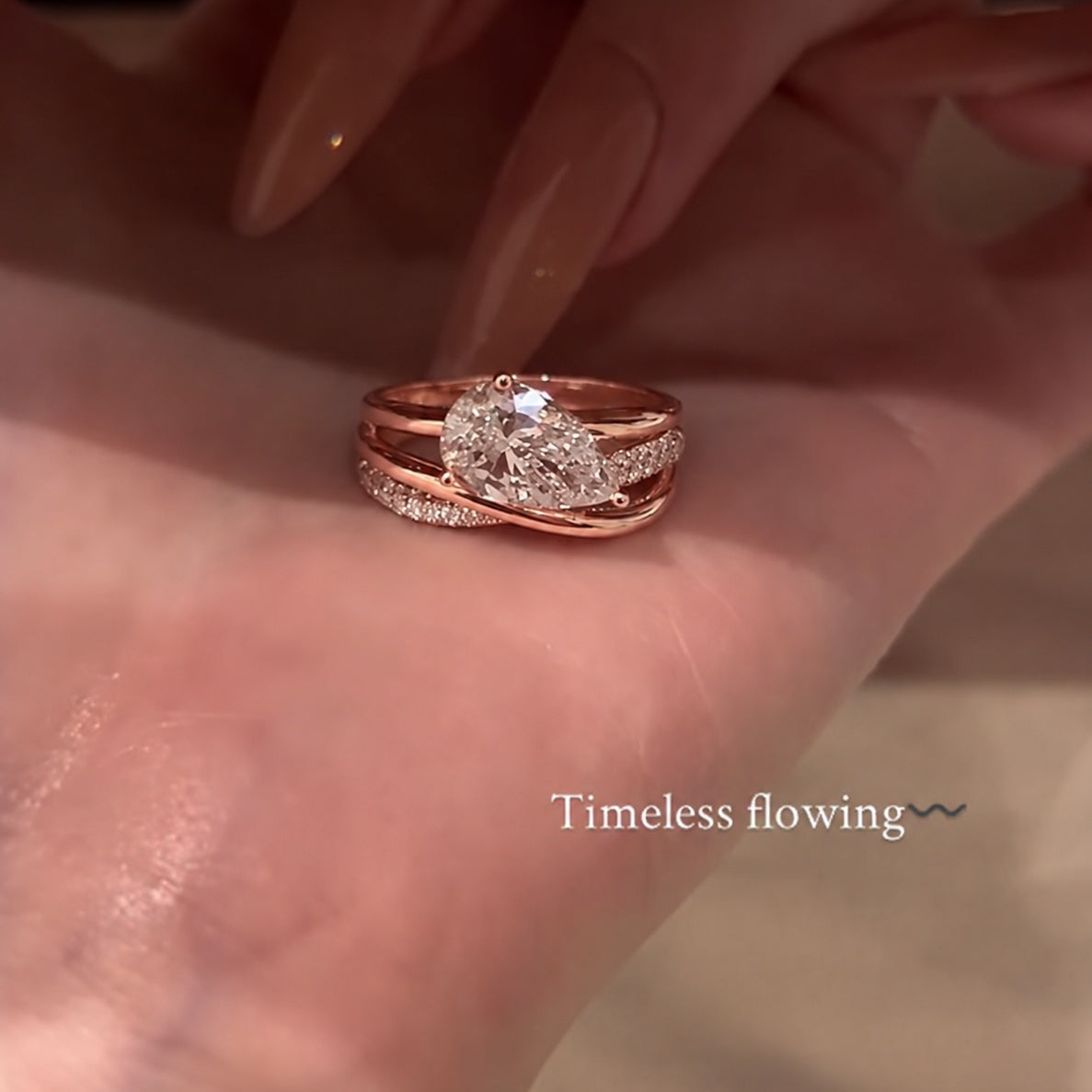 Elegant 2.0ct Pear Cut Intertwined Crossover Engagement Ring