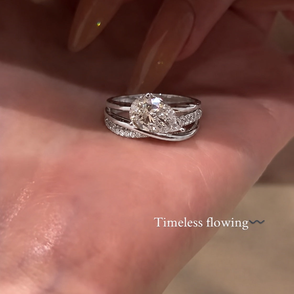 Elegant 2.0ct Pear Cut Intertwined Crossover Engagement Ring
